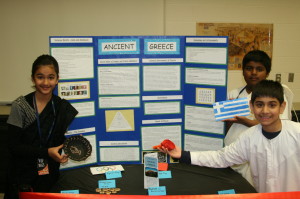 These students worked on this display about those who lived in Ancient Greece, who Selena Gosal (left) said were “really nice people.” She was joined by Kizoth Raventhirakumar and Idris Nasir. 