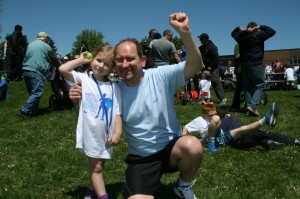 Dalma Svab, 4, of Caledon East, celebrated with her father Frank after completing her Kids of Steel triathlon.