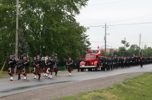 An honour guard, with representation from various fire services, marched through the streets of Caledon East Tuesday morning, accompanying the fire truck carrying the casket of Deputy Chief Tony Lippers.