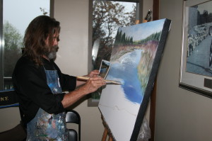 Artist Mark Grice, who paints out of his studio at Alton Mill, was working on this acrylic creation which depicted a scene from the Credit River. Photos by Bill Rea