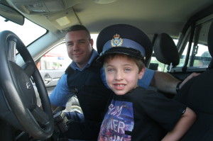 Caledon OPP were well represented at the festivities as they were showing some of their equipment. Auxiliary Constable Shane Atkinson was showing Nolan Searles, 7, from Caledon East the inside of a police cruiser. 