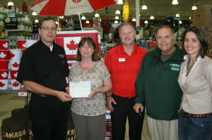 Bolton Canadian Tire proprietor Chris Hartleib presented this contribution to Foley, Miller, Whitehead and Campbell. Photo by Bill Rea