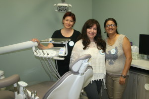 NEW DENTAL OFFICE OPENS IN BOLTON Dr. Mindy Gelfano is seen here with her receptionists Larysa Savchenko and Neepa Soni at Saturday's opening of Bolton Park Dentistry on Parr Boulevard. “I've just always wanted to be in Bolton,” Gelfano said. Photo by Bill Rea 