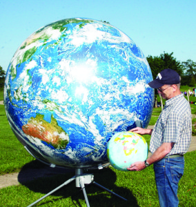 Grant Linney from Dundas (formerly from Bolton), a retired outdoor environmental education teacher, was on hand with this big globe, six feet in diameter, trying to get people to think about the planet they live on. He also had this smaller version, showing the political layout of the earth. Photos by Bill Rea 