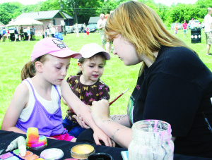 Youngsters were anxious to get their faces or arms painted. Kalleigh Mattine, 4, of Inglewood was a watching as Erin resident Kaitlyn Lister painted a design for her sister Melinda, 7.