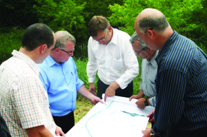 Bob Nieuwenhuysen, manager of roads capital for the Region and original project manager for the BAR, was going over a map of the project with Councillor Rob Mezzapelli, Regional Commissioner of Public Works Daniel Labrecque, Regional Director of Transportation Damian Albanese and Councillor Allan Thompson. Photo by Bill Rea