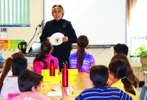 Caledon OPP Constable Brenda Evans talks to students at St. Cornelius School about safety around roads.