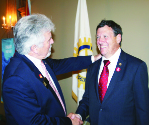 NEW DISTRICT GOVERNOR FROM PALGRAVE Michael Gauthier last Wednesday received congratulations from Ian Ferguson of Burlington as he succeeded him as Governor of District 7080 of Rotary International. The changeover took place at the annual district convention at the Royal Ambassador Event Centre near Caledon East. The district consists of some 50 clubs, from Woodstock to Palgrave, and north to Shelburne. Photo by Bill Rea
