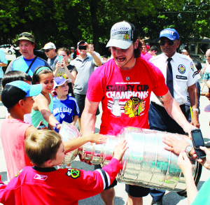 Community welcomes Stanley Cup and Dan Carcillo Residents and visitors turned out by the hundreds to catch a glimpse of Canada's most prestigious sports icon, the Stanley Cup. Dan Carcillo, of the Stanley Cup champion Chicago Blackhawks, returned home to King City Sunday to a hero's welcome. In case you missed the Cup, it will return this Sunday to Schomberg with Chicago assistant coach Mike Kitchen. They'll be at the Trisan Centre from 11 a.m. to 2 p.m. Photo by Jeff Doner