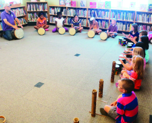HARD TO ‘BEAT' THIS PROGRAM There was a good crowd of youngsters out Tuesday at the Margaret Dunn — Valleywood branch of Caledon Public Library for Mystic Drumz. The drum workshop was conducted by Dave Gould. Photo by Bill Rea