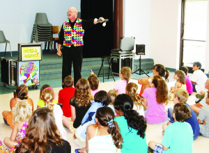 MAGIC TIME IN ALTON Magician Peter Mennie from London had a whole roomful of kids and parents entertained when he appeared in Alton recently. The performance was hosted by Caledon Public Library. Photo by Bill Rea