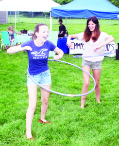 Youngsters at the Children's Day activities had the chance to try some different things, like hula hoops. Market volunteers Rebecca Jarvis and Makenzie Grima, both of Cheltenham, were showing everyone how it's done. Photos by Bill Rea