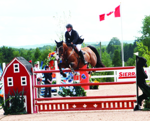 Caledon resident Chris Sorensen was guiding Wriomf over this jump, one of two mounts he had entered Saturday.