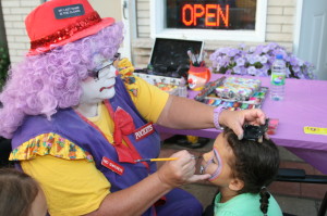 Pockets the Clown was painting faces outside The Mortgage Centre offices. Jessica Vella, 5, of Bolton was one of her customers.