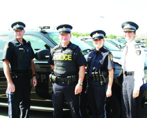 This camera is one of three mounted on the roof of this police vehicle that will be registering information from licence plates to aid police. Seen here are OPP constables Steve Szabo, John Rosa, Brenda Evans and Inspector Rose DiMarco. Photo by Bill Rea