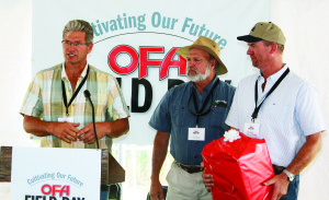 Ontario Federation of Agriculture President Mark Wales (middle) joined Philip and Peter Armstrong in welcoming those on hand for last week's farm field day.