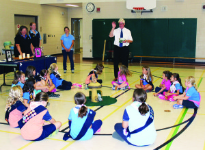GUIDES LEARN ABOUT GOVERNMENT Dufferin-Caledon MP David Tilson paid a call recently on the Palgrave Guides Brownies and Sparks. He told the girls and thier parents about some of the points of his job in the riding and Ottawa. Photo by Bill Rea
