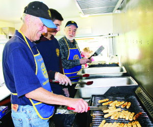 There was plenty to eat at the Terry Fox Runs. The Rotarians served a pancake breakfast in Palgrave. Seen working on the grill are Doug Nicholson, Karl Robinson and John Cox.