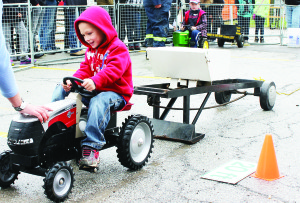 Sunday saw the Kiddie Pedal Pull. Jack Spencer, 4, of Cedar Mills, was giving it everything he had.