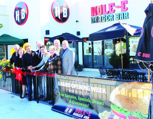 Hole-E Burger proprietor Mark Sibilia was joined by Justin Lebofsky, a business partner, and Mayor Marolyn Morrison for the official opening of the Bolton restaurant Monday. Also on hand were Caledon Councillors Gord McClure and Patti Foley, Dufferin-Caledon MP David Tilson and Councillors Richard Paterak and Allan Thompson.