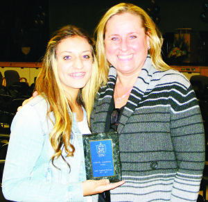 CATHOLIC LEADERSHIP RECOGNIZED St. Michael Catholic Secondary School in Bolton held its 2012-2013 Awards Night Oct. 24, honouring the school's top academic performers and student leaders. Here, Lexie Hesketh-Pavilons received the Catholic Leadership Award from school chaplain Urszula Cybulko. Photo submitted