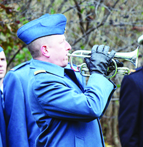 Captain Lennard Johnston of the Canadian Forces School of Aerospace Technology and Engineering played the Last Post at the service in Bolton.