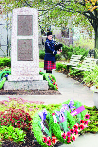 Captain Donald Rea of Caledon Fire and Emergency Services served as piper at Monday's service. Photos by Bill Rea