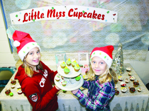 Sydney Rayner and Denele Barron, Grade 7 students at Caledon East Public School combined to make this entire inventory of Little Miss Cupcakes for their table at the annual Christmas Craft Show at the school recently.Photos by Bill Rea