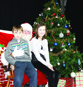 Santa Clause was a big hit at the Christmas Craft Show, meeting many of his friends like Christopher Goertzen, 6, and his sister Megan, 9.