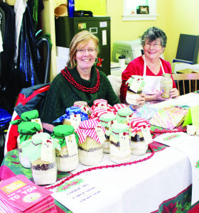 Palgrave United Church was a busy place recently for the bazaar, bake sale and silent auction. If one was planning a meal, Barb Imrie had a supply of cookie mix while Lorraine Witty was holding up some turkey soup. Natalia Koster and Brianne Purchase of the 1st Palgrave Guides, were selling Girl Guide cookies.     Photos by Bill Rea