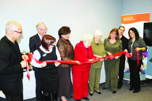 Supportive housing residents Doreen Davison and Jan Gordon were given the honour of cutting the ribbon last Thursday to officially open the new Caledon Specialist Clinic. Also on hand was Caledon Community Services CEO Monty Laskin, Central West LHIN CEO Scott McLeod, Headwaters Program Director Mary Wheelwright, LHIN Board Chair Maria Britto, Councillors Patti Foley and Rob Mezzapelli, and clinic coordinator Darlene Lajoie. Photo by Bill Rea
