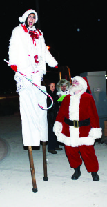 The area of Raeburn's Corner in Caledon village was a busy and festive place Saturday night. The Caledon Village Association's annual Santa Claus Parade ended there, and there was a big crowd out to greet the guest of honour. Santa was joined by this tall elf named Hala from Toronto.