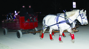RIDING AROUND SOUTHFIELDS Lots of local residents took advantage of the horse and wagon rides offered Friday night by the Southfields Village Residents' Group. Vanessa Chidwick and James Sokoluik were driving the team through the streets of the village. There will be similar rides offered this Saturday (Dec. 14) from 6 to 9 .m. They will start at SouthFields Village Public School. The cost for the 15-minute ride will be $10 per person (children five and younger can ride for free). Visit www.eventbrite.ca/event/8984600181 or contact Kenneth Bokor at kenneth.bokor@gmail.com for more information. Photo by Bill Rea