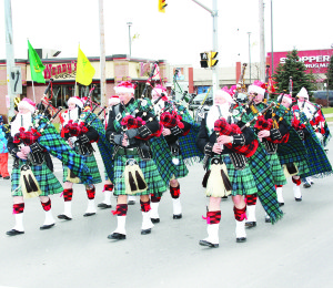 Members of the Sandhill Pipes and Drums even added some Santa-style beards for their performance.
