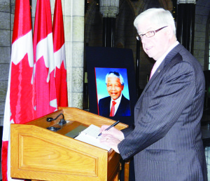 Dufferin-Caledon MP David Tilson signed a book of condolence for former South African president Nelson Mandela.