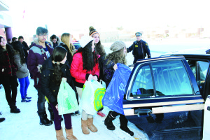 These students from Allan Drive Middle School in Bolton were lined up to load their contributions into this police cruiser. Photo by Bill Rea