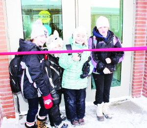 NEW ALTON SCHOOL OPENS Students at Alton Public School started a new year with a brand new school to attend. The new facility is now up and running. The ribbon was cut by students Samantha Intranuovo, Jessie McClellan, Nicole Intranuovo and Ashley McClellan. They each represent the fifth generation attending the school. Photo by Bill Rea