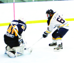 Caledon Golden Hawk forward Daniel Cafagna storms the Huntsville Otters' net during Sunday night's game at Caledon East. Cafagna is currently the teams top point earner. He scored four goals in the first period of Sunday's game. Photo by Brian Lockhart