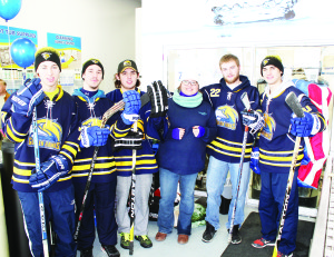 HOMETOWN HOCKEY DAY Water Depot Bolton hosted Hometown Hockey Day to raise money and equipment to help Caledon Minor Hockey. Sabrina Bucciol of Water Depot was joined by several members of the Caledon Golden Hawks Jr. C Hockey Tea, including Adam Breen, Derek Czech, Chris Vellucci, Nick McNutt and Brett Bloor. Photo by Bill Rea