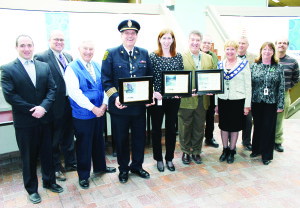 Mayor Marolyn Morrison last week presented plaques of appreciation to Fire Chief David Forfar, Parks and Recreation Director Kristene Scott and Public Works Director David Loveridge. Joining her for the presentation were Councillors Rob Mezzapelli, Allan Thompson, Doug Beffort, Richard Whitehead, Gord McClure, Patti Foley and Nick deBoer. Photo by Bill Rea