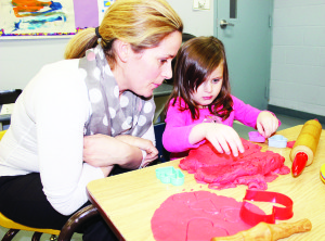 Family Fun Night at CPCC The season of Valentines could not be allowed to pass without some family fun at Caledon Parent-Child Centre in Bolton, and that's just what happened last Thursday night. Christina Pilotti of Bolton watched while her daughter Olivia, 4, fashioned hearts from playdough. Photos by Bill Rea
