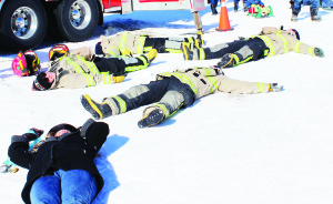It wasn't quite as bad as it looks. On a signal, people at SnowFest were asked to drop and make snow angels on the ground. These firefighters obliged.