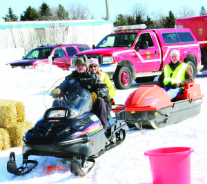 Dufferin-Caledon MPP Sylvia Jones and MP David Tilson got to ride into the grounds in style, courtesy of Zen Slipenkyj of the Orangeville Snowmobile Club.