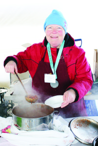 The Caledon Agricultural Society won the medal in the Chilly Cook-Off. Glenda Simeone was showing off the medal.