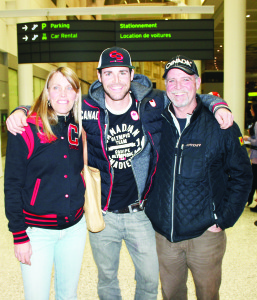 Belfountain snowboarder Jake Holden arrived Monday night at Pearson International Airport, home from the Winter Olympics in Sochi. He was greeted by his mother Renee and father Waldo. Photo by Bill Rea