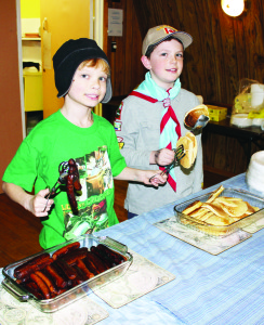 Carson Burke and Sean Sweeney of the 1st Alton Cubs were helping to serve at the Legion hall.