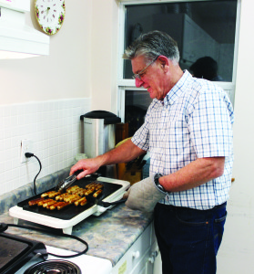 John Carley was making sure the sausage was cooked at St. James' Anglican Church in Caledon East.