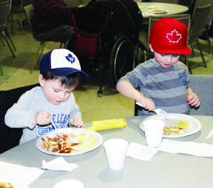 Wesley Speirs, 2, and his cousin Charlie, 3, were eating heartily at the Brampton Fairgrounds.