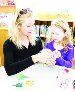 Trish Burton was helping her daughter Leah, 6, put some parts together.