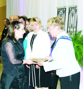 SouthFields Village resident Yevgenia Casale was congratulated by Mayor Marolyn Morrison on receiving her volunteer recognition Monday night.